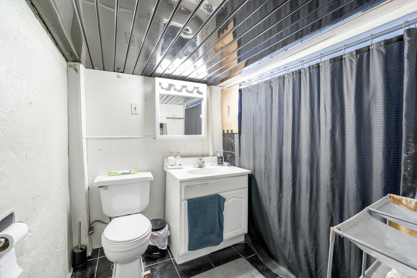 2530 North Neva Avenue Chicago, IL 60707 - Photo 33 of 50 a bathroom with a sink toilet and shower