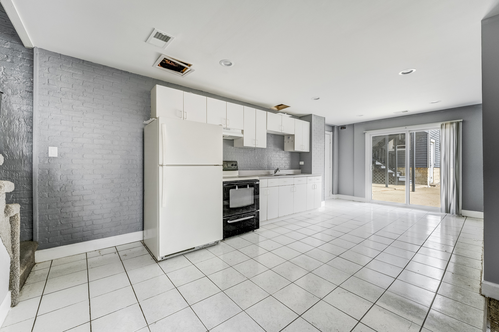 2530 North Neva Avenue Chicago, IL 60707 - Photo 37 of 50 a kitchen with white cabinets and refrigerator