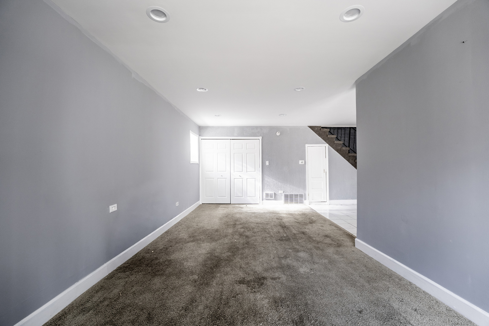 2530 North Neva Avenue Chicago, IL 60707 - Photo 39 of 50 a view of a big room with windows and cabinet