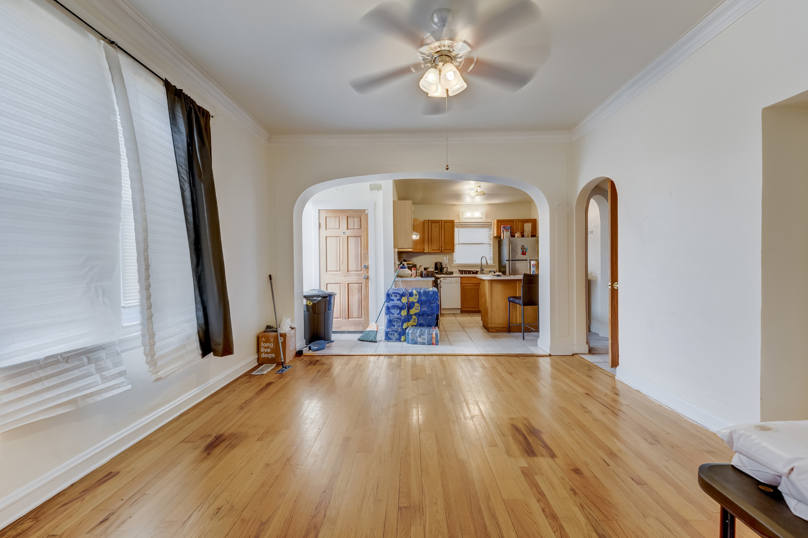 2530 North Neva Avenue Chicago, IL 60707 - Photo 6 of 50 a view of a room with wooden floor gym equipment and windows