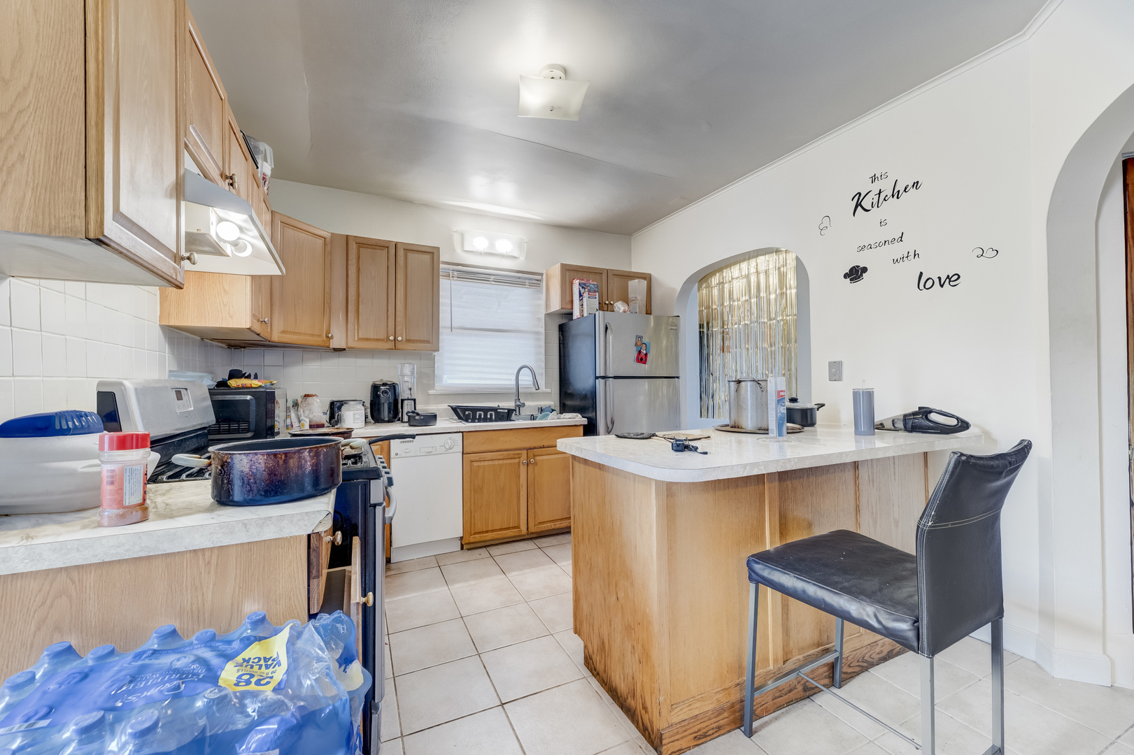 2530 North Neva Avenue Chicago, IL 60707 - Photo 7 of 50 a kitchen with a sink appliances and cabinets