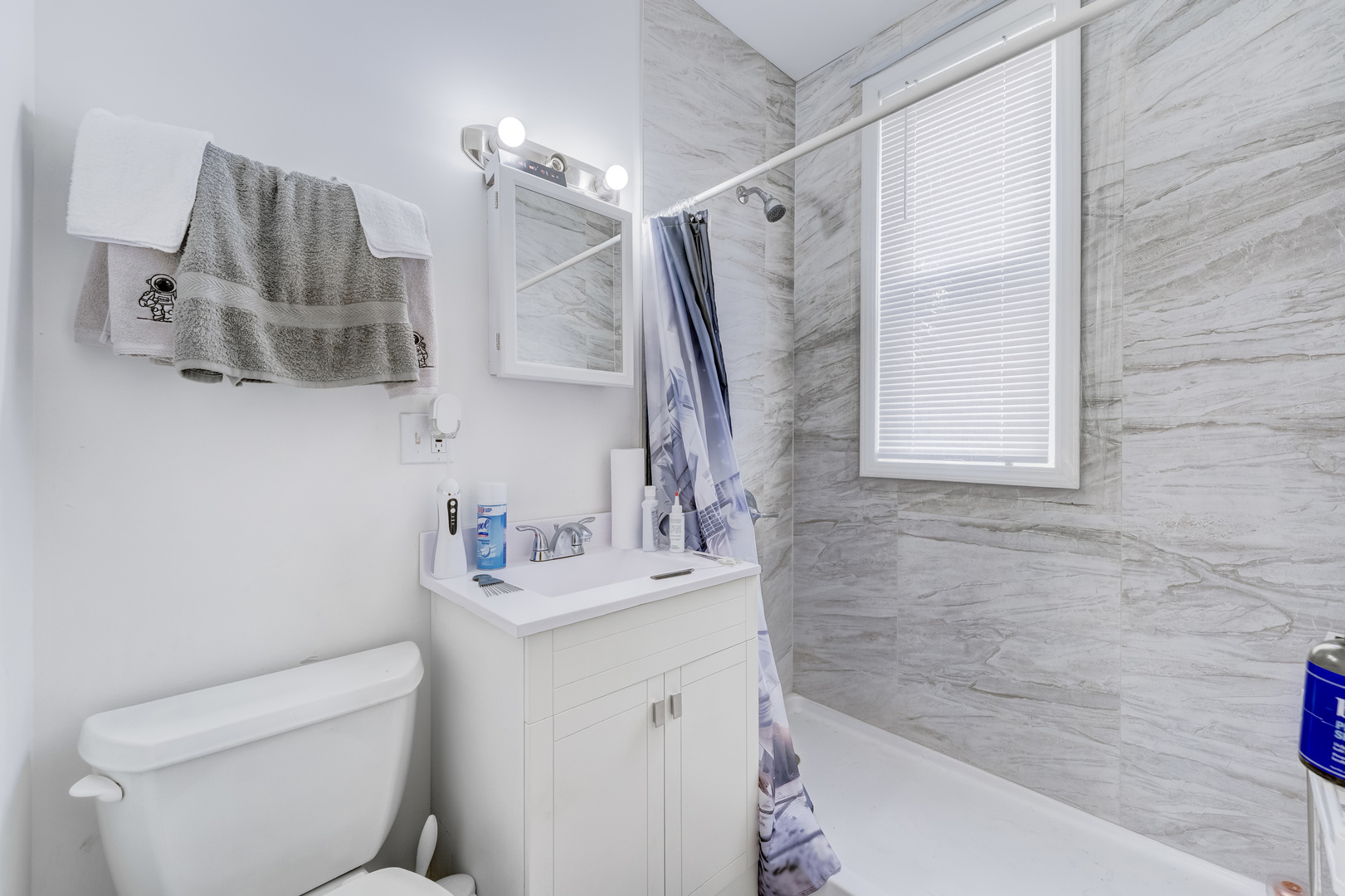 2530 North Neva Avenue Chicago, IL 60707 - Photo 10 of 50 a bathroom with a sink toilet and shower