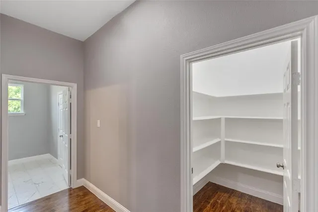 a view of a hallway with closet