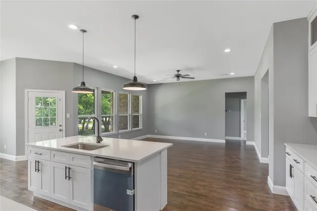 a kitchen with a sink and window