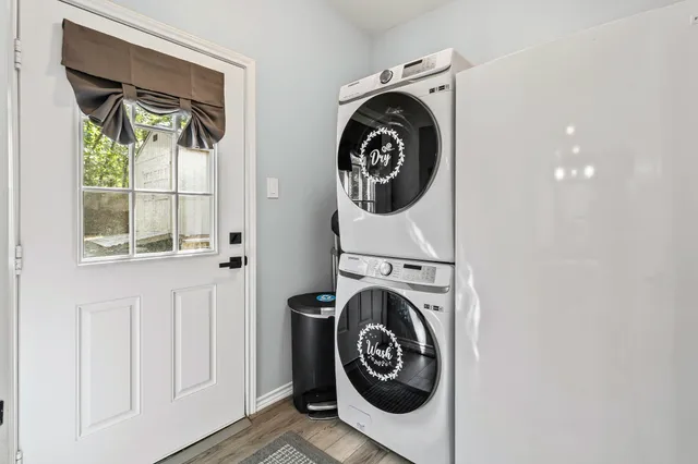 a view of a storage and utility room with washer and dryer