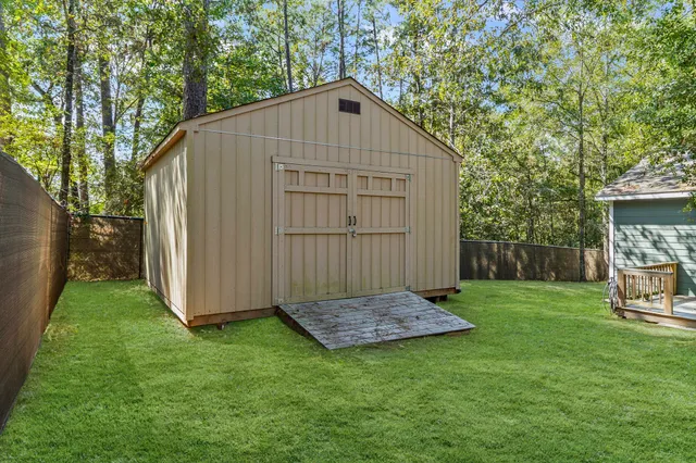 a view of backyard with tub and trees