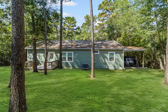 a view of a house with a yard balcony and a patio