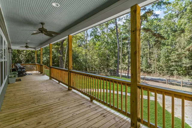 a view of a balcony with wooden floor