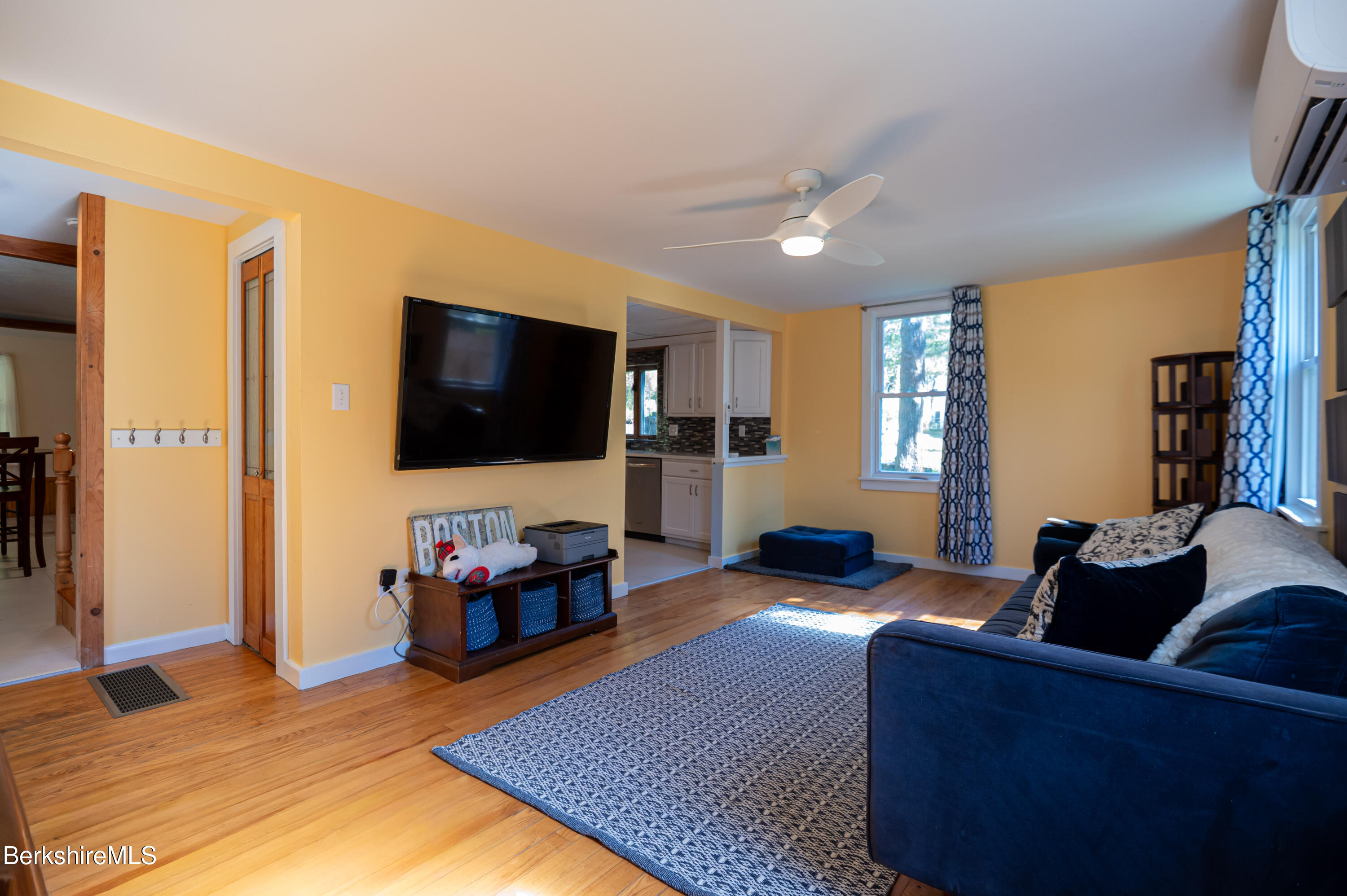 1600 Pleasant Street Lee, MA 01260 - Photo 16 of 26 a living room with furniture and a flat screen tv