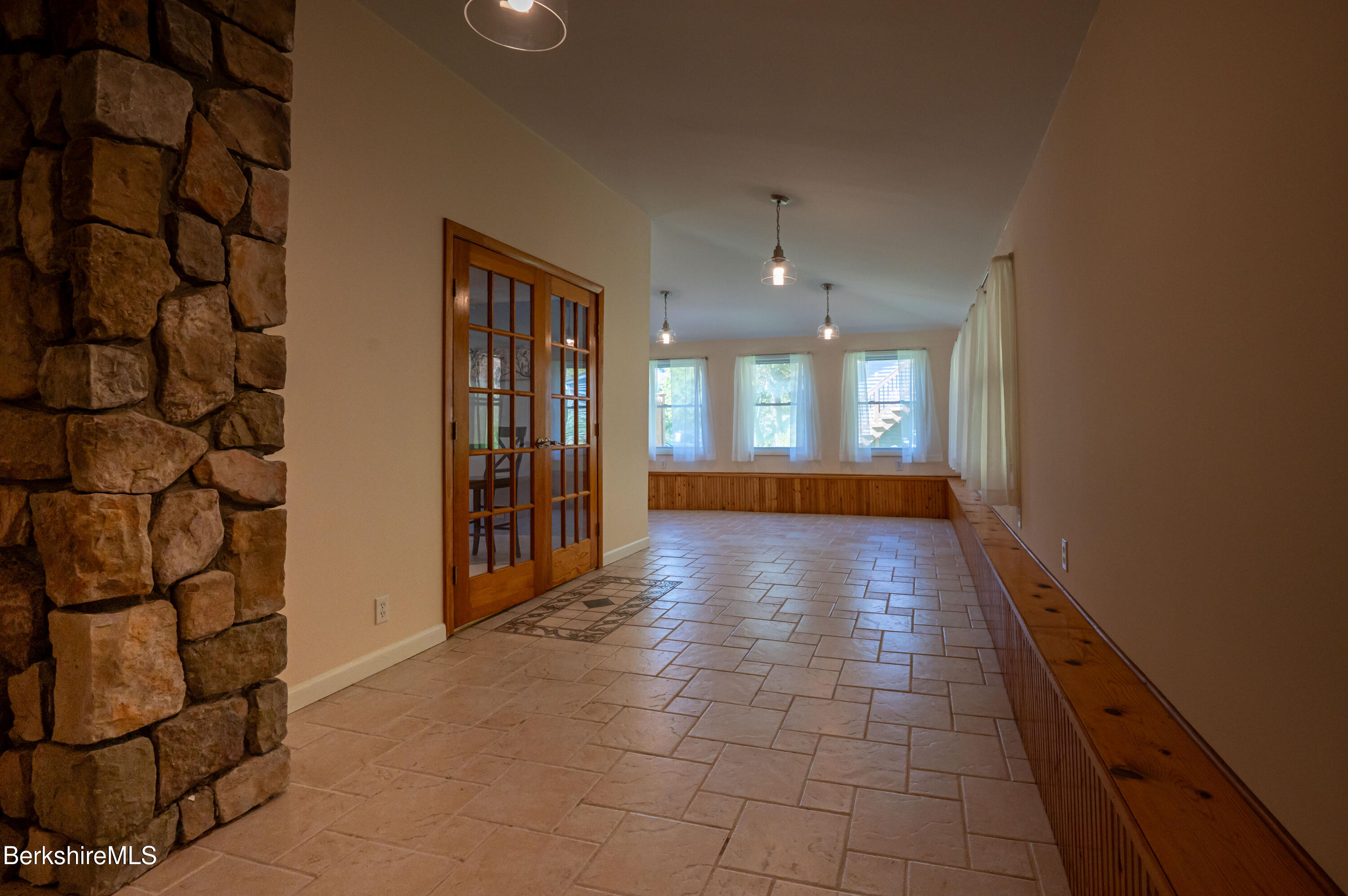 1600 Pleasant Street Lee, MA 01260 - Photo 18 of 26 a view of a hallway with wooden floor and a living room