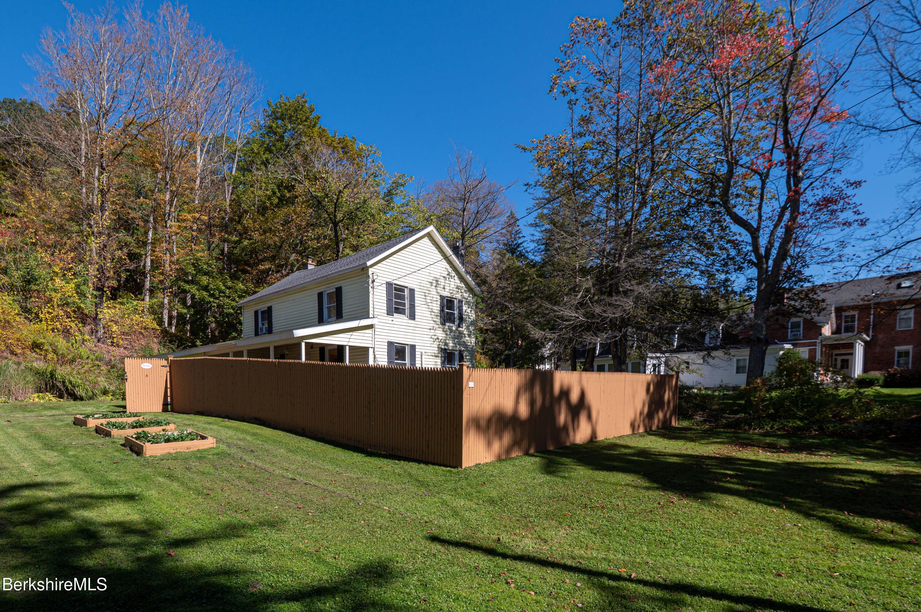 1600 Pleasant Street Lee, MA 01260 - Photo 2 of 26 a front view of a house with a yard