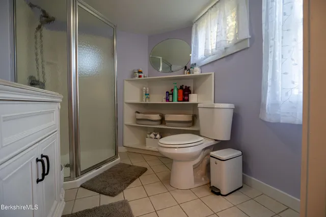 a view of a hallway view with wooden floor and staircase