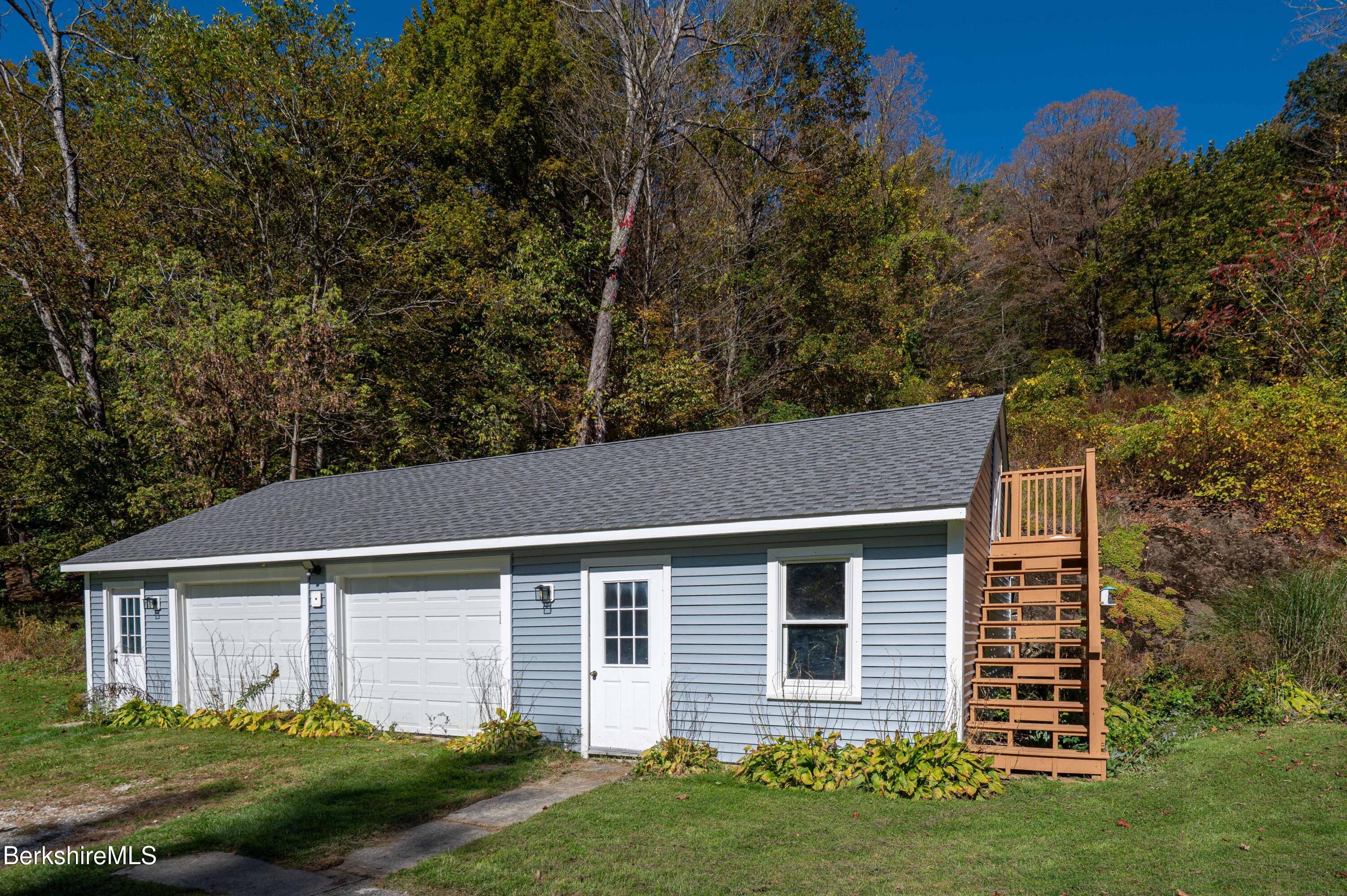 1600 Pleasant Street Lee, MA 01260 - Photo 6 of 26 front view of a house with a yard