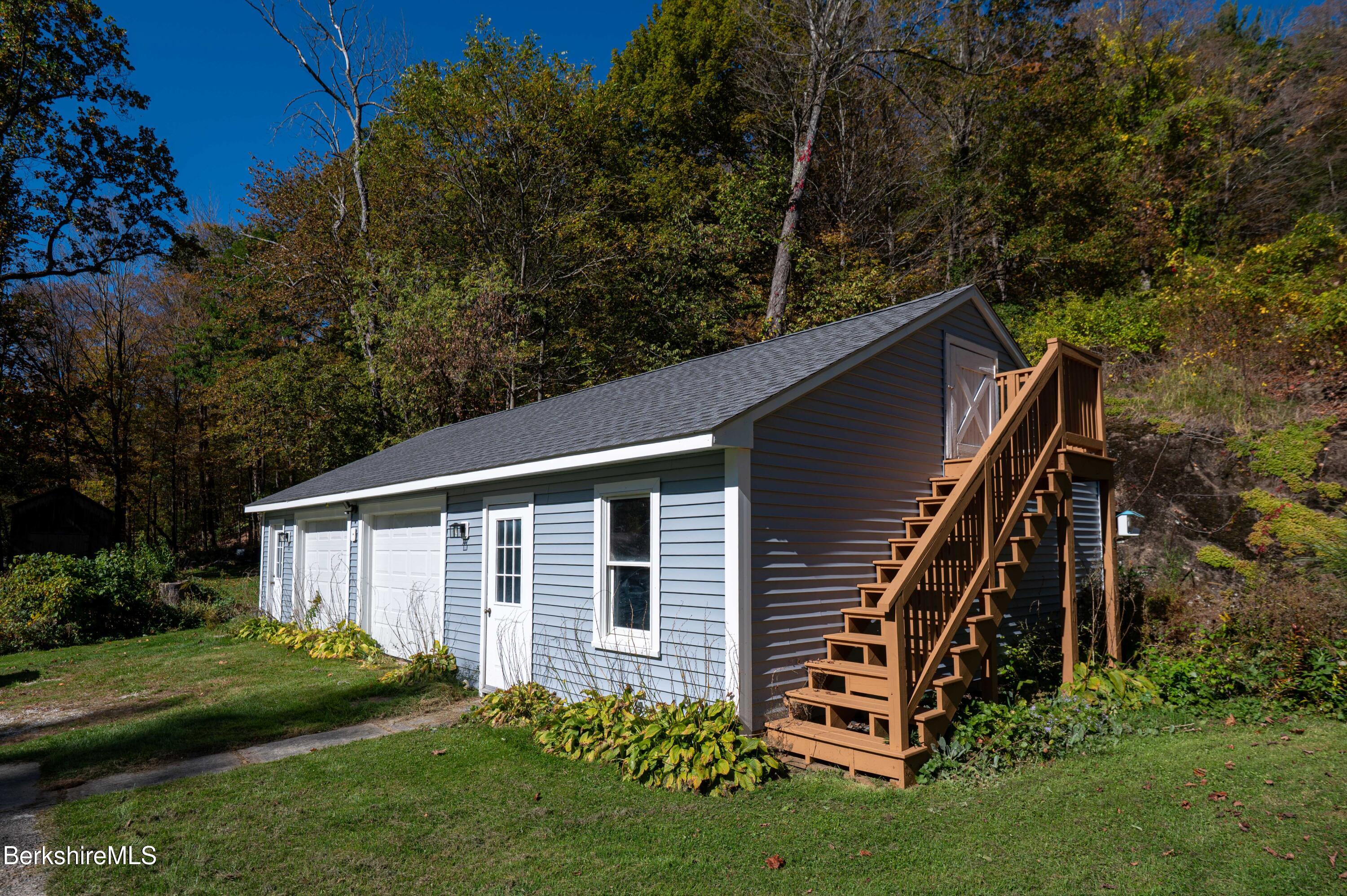1600 Pleasant Street Lee, MA 01260 - Photo 7 of 26 a backyard of a house with lots of green space