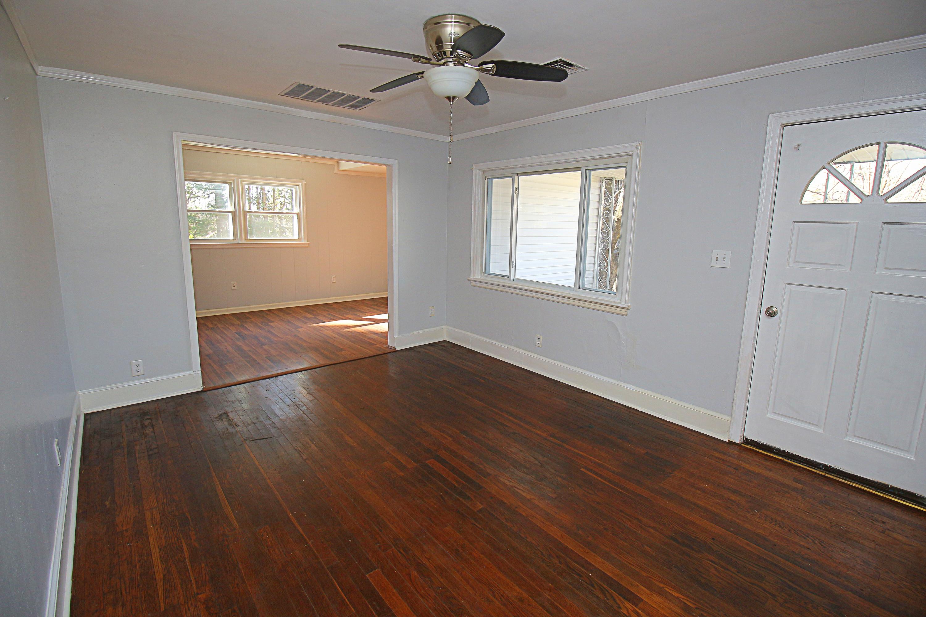 71 Rabbits Way Blue Ridge, VA 24064 - Photo 3 of 23 a view of an empty room with wooden floor and a window