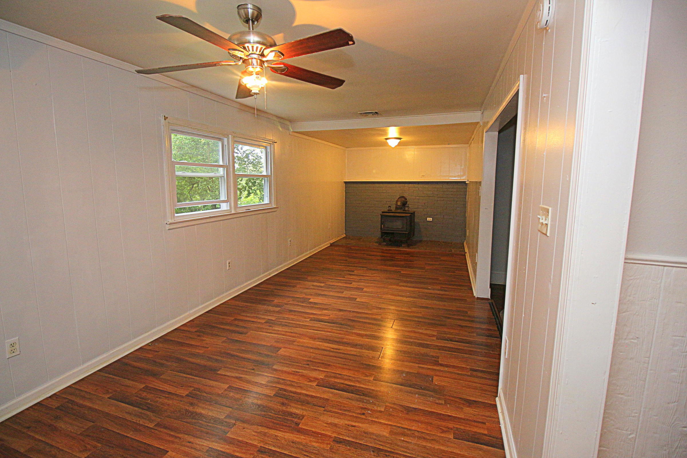 71 Rabbits Way Blue Ridge, VA 24064 - Photo 4 of 23 a view of a room with wooden floor and a ceiling fan