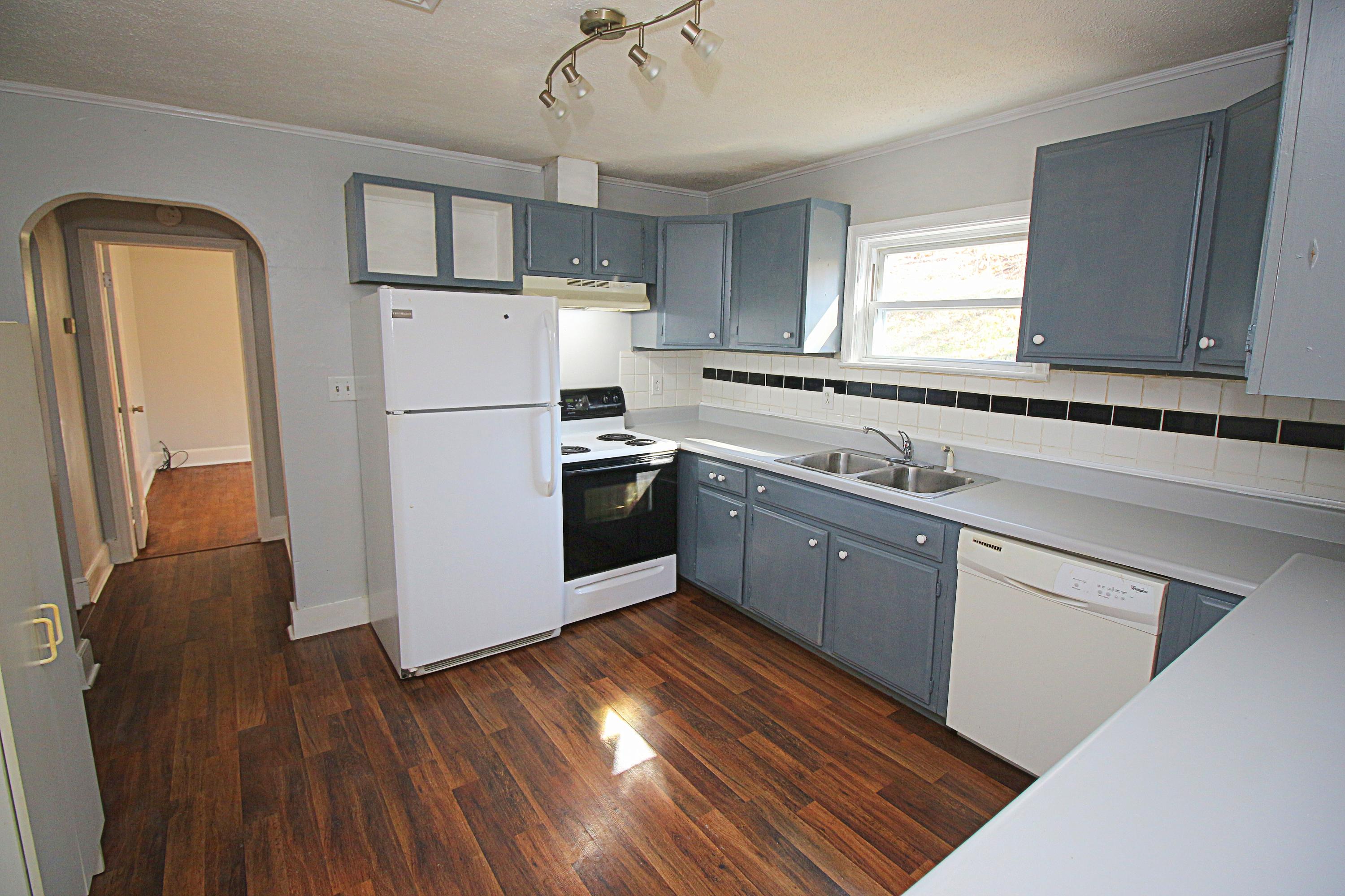 71 Rabbits Way Blue Ridge, VA 24064 - Photo 6 of 23 a kitchen with wooden floors and white appliances