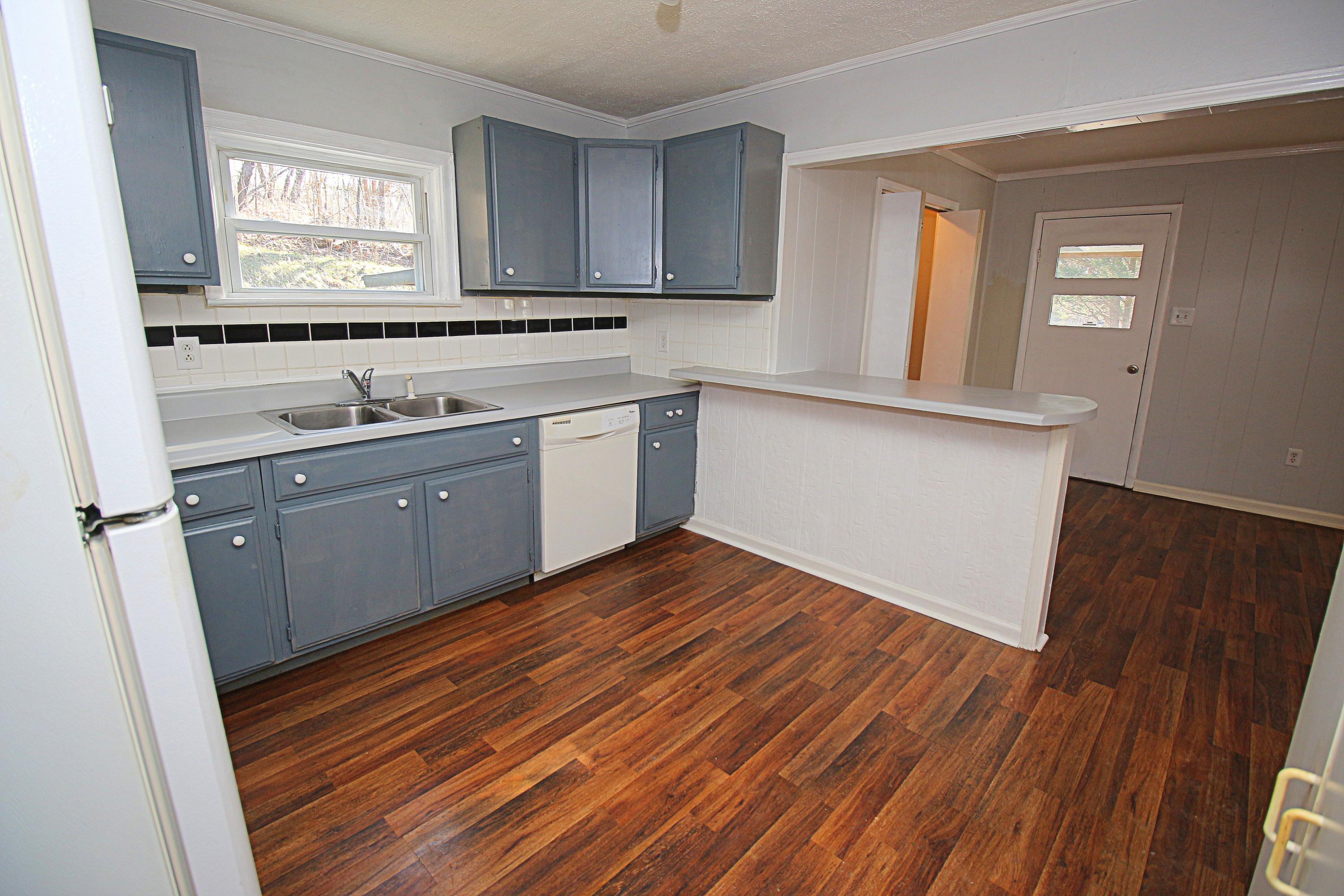 71 Rabbits Way Blue Ridge, VA 24064 - Photo 7 of 23 a kitchen with wooden floors and sink