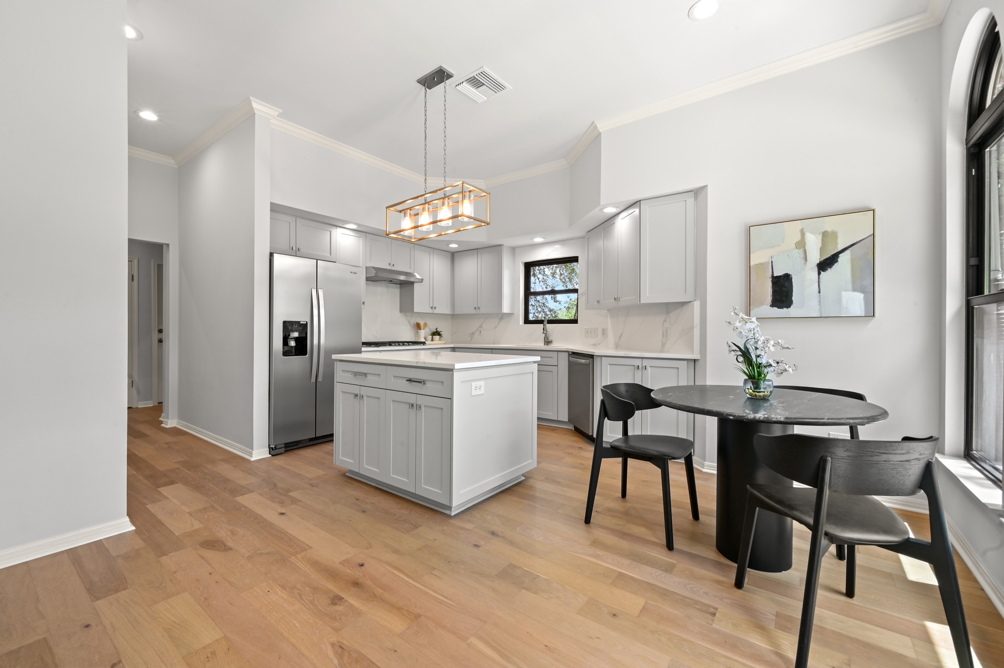Culinary adventures await in this kitchen, boasting an island and stainless steel appliances.