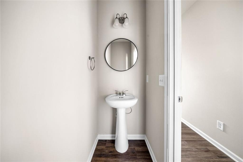 217 Whitetail Circle Canton, GA 30115 - Photo 17 of 30 a bathroom with a sink and a mirror