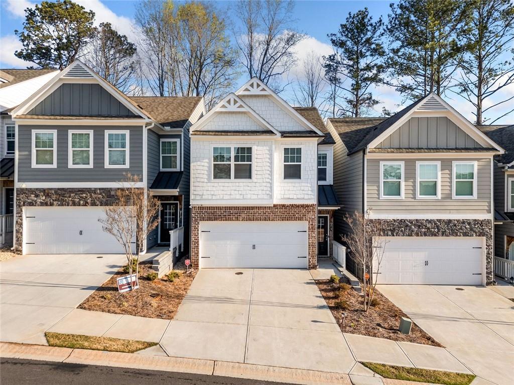 217 Whitetail Circle Canton, GA 30115 - Photo 2 of 30 a front view of a house with a yard