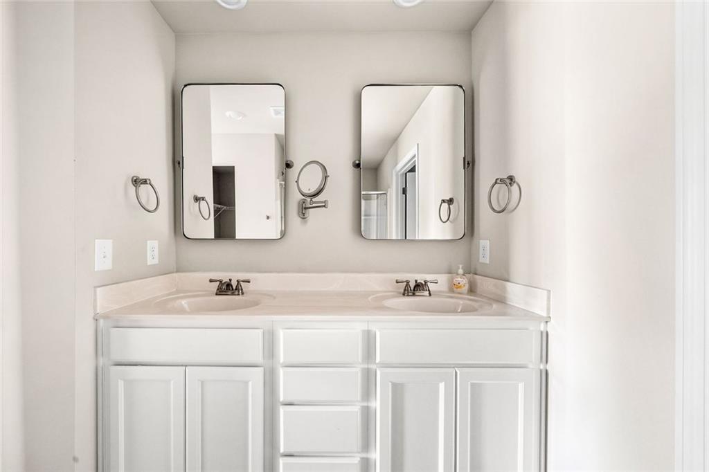 217 Whitetail Circle Canton, GA 30115 - Photo 25 of 30 a bathroom with 2 sink and a mirror
