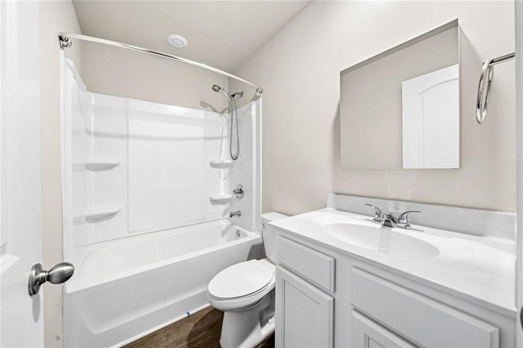 217 Whitetail Circle Canton, GA 30115 - Photo 28 of 30 a bathroom with a sink toilet and shower