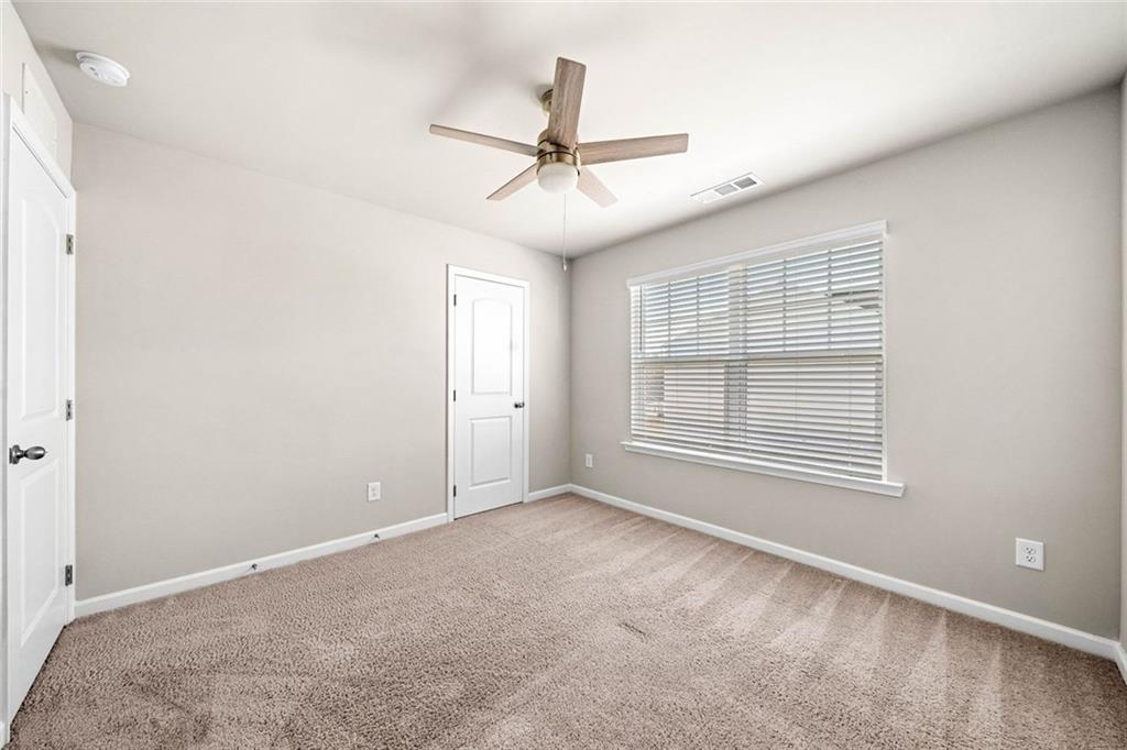 217 Whitetail Circle Canton, GA 30115 - Photo 29 of 30 a view of an empty room with a window