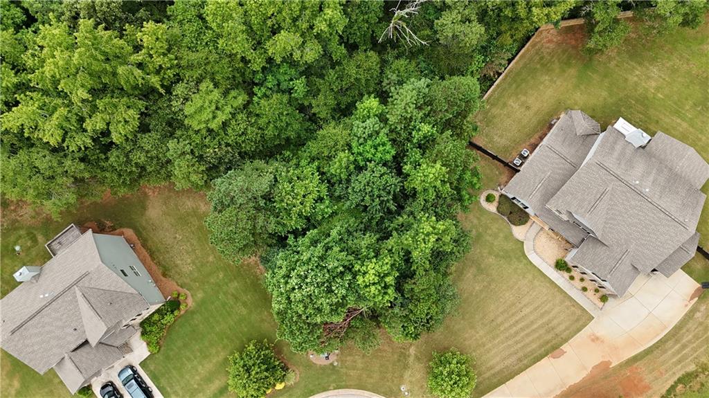 305 Vantage Point Locust Grove, GA 30248 - Photo 2 of 17 an aerial view of a house with a yard and lake view