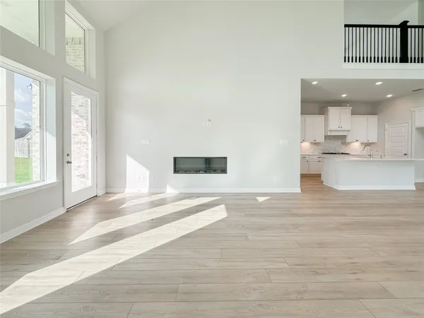 a view of kitchen with cabinets and wooden floor
