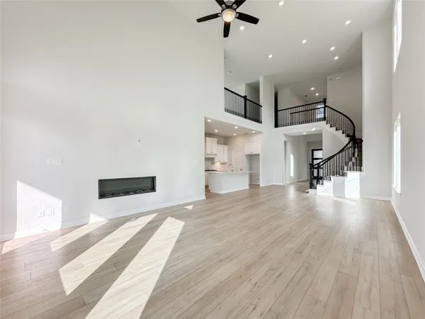 a view of a livingroom with a ceiling fan and window