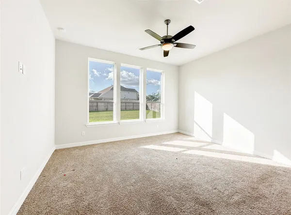 an empty room with closet area