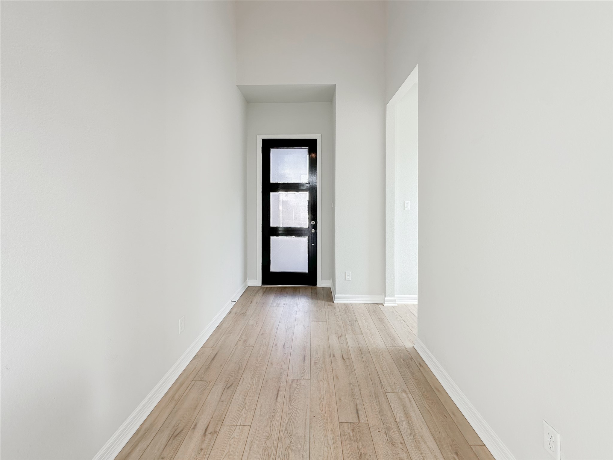 9411 Coleraine Court Tomball, TX 77375 - Photo 2 of 34 an empty room with wooden floor and closet