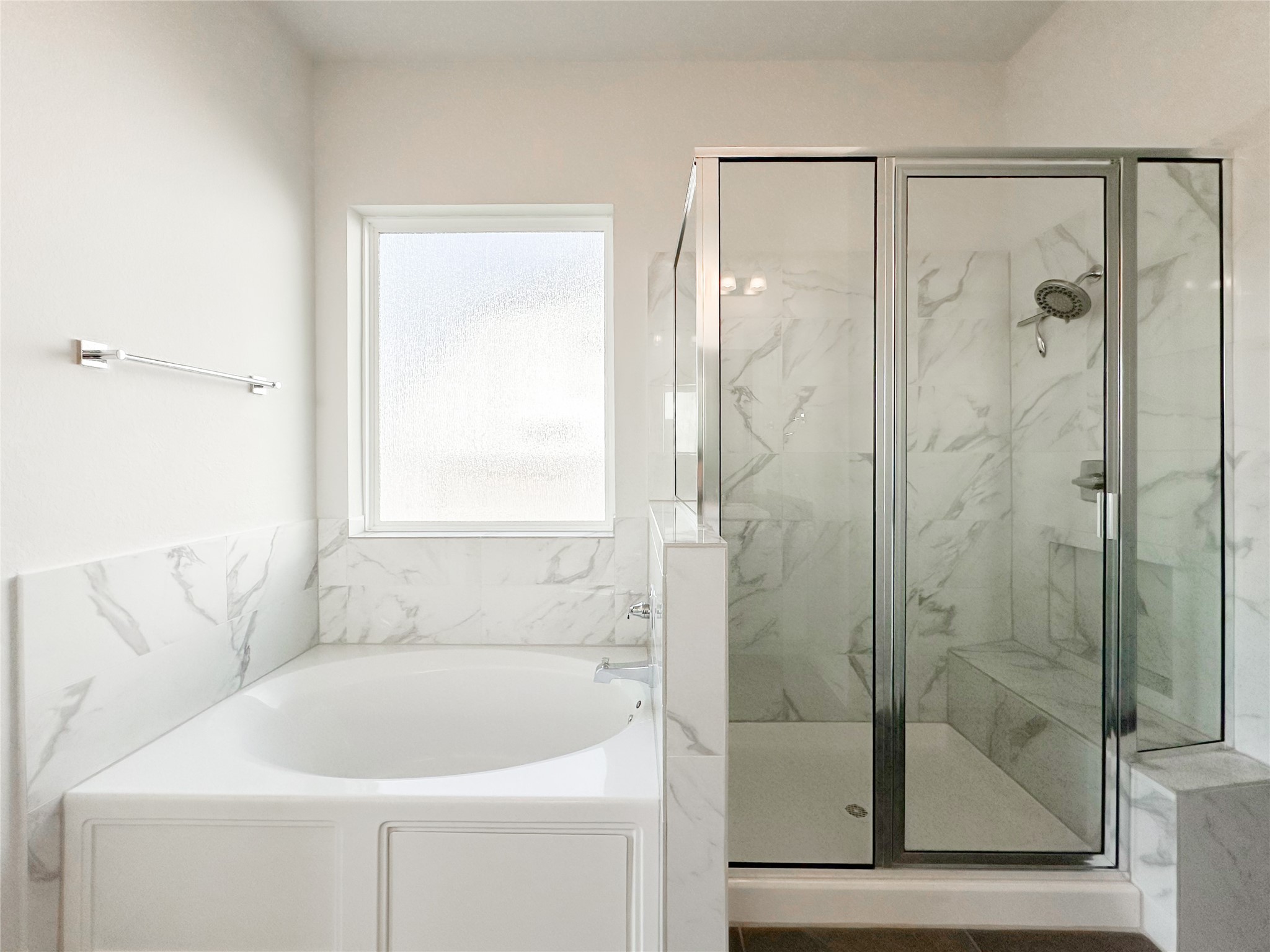 9411 Coleraine Court Tomball, TX 77375 - Photo 22 of 34 a bathroom with a bathtub and a shower