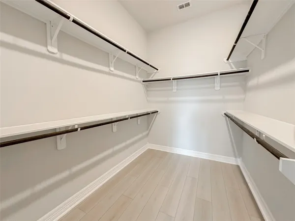 an empty room with a empty space and windows