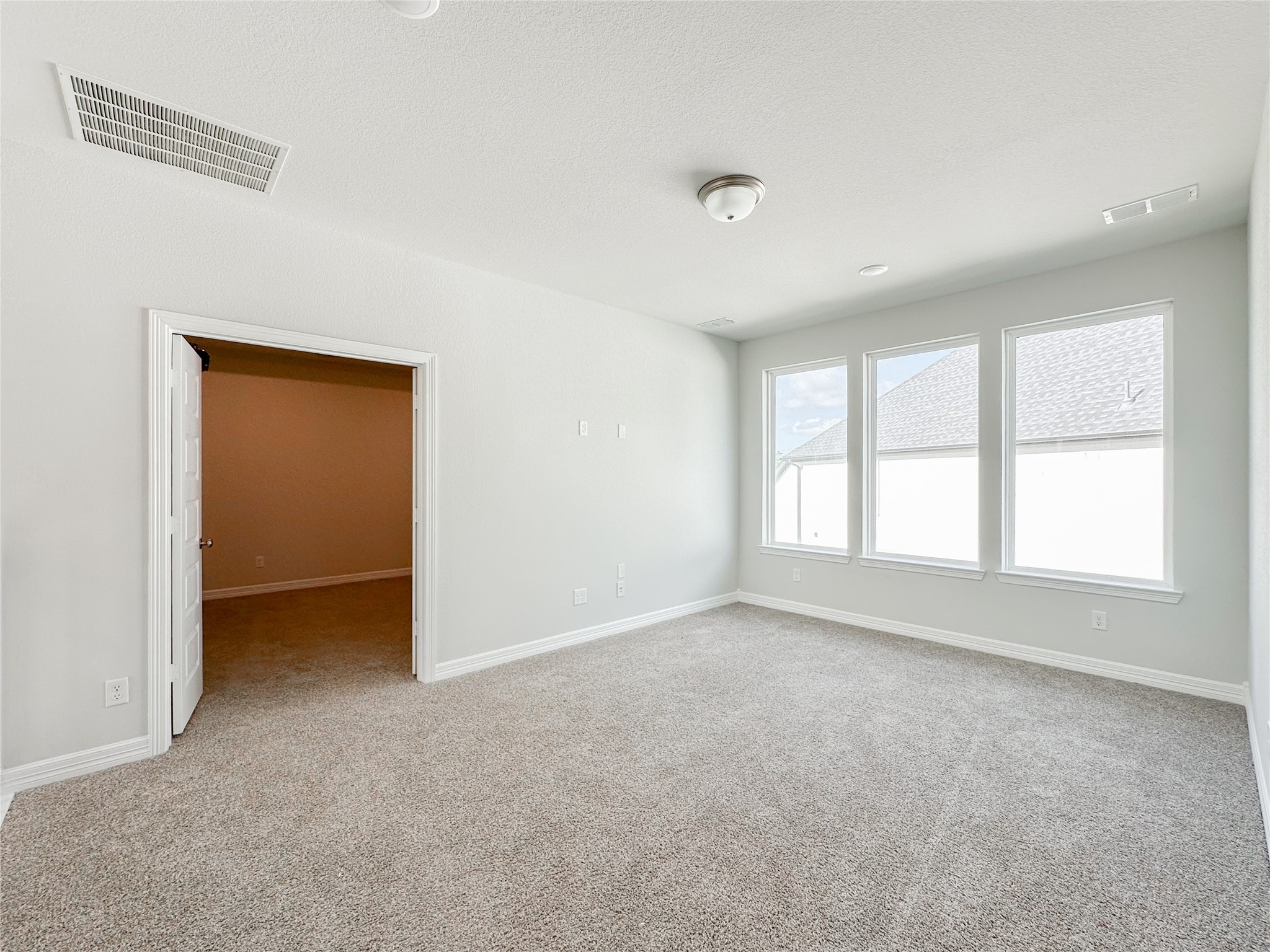 9411 Coleraine Court Tomball, TX 77375 - Photo 30 of 34 an empty room with a empty space and windows