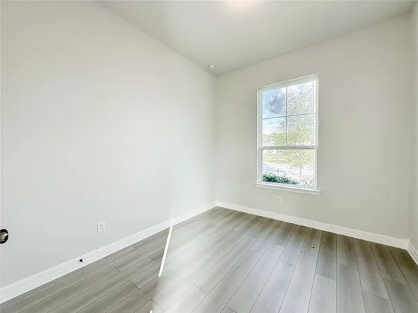a bathroom with a bathtub shower sink vanity and toilet