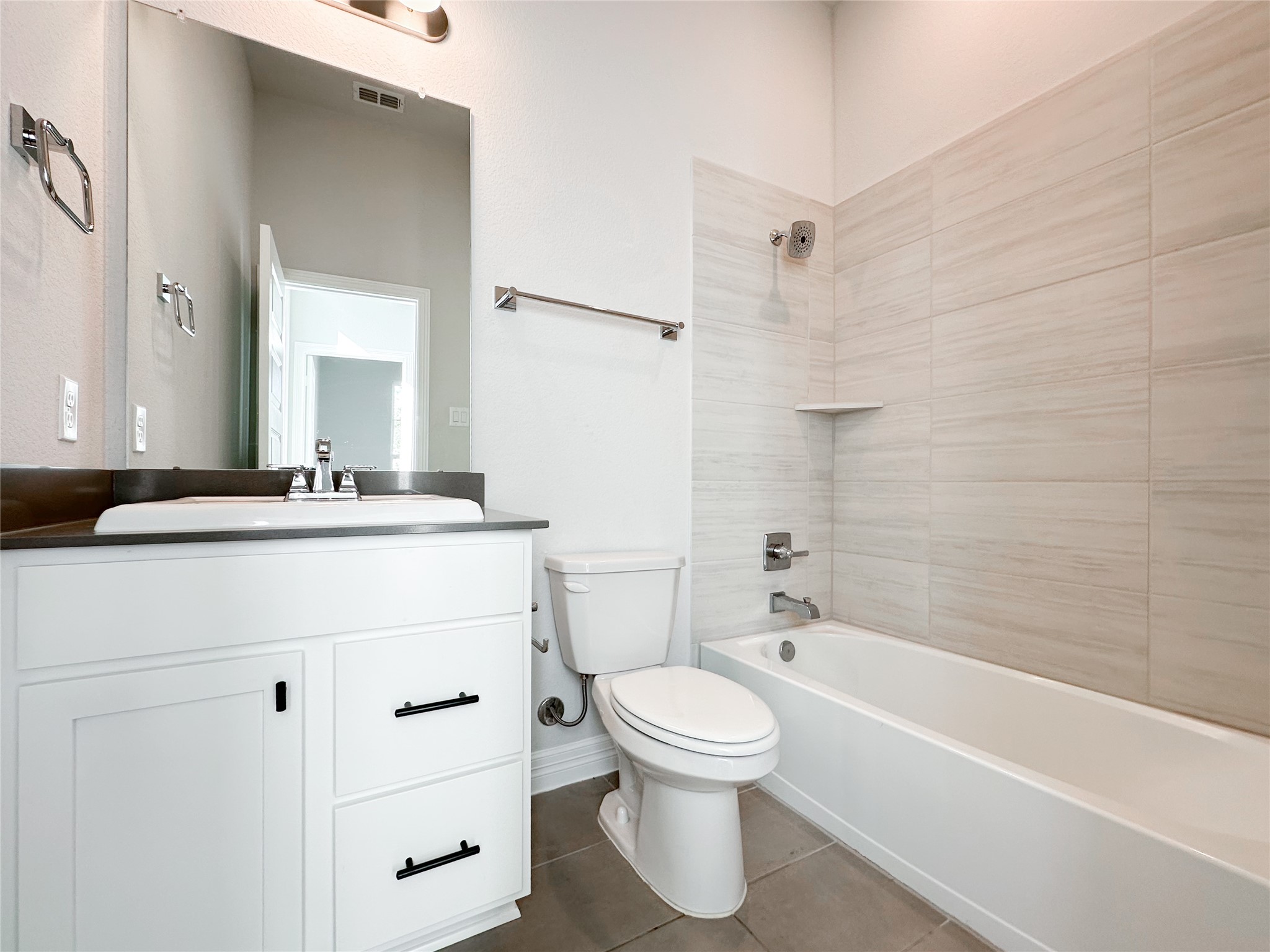 9411 Coleraine Court Tomball, TX 77375 - Photo 6 of 34 a bathroom with a bathtub shower sink vanity and toilet