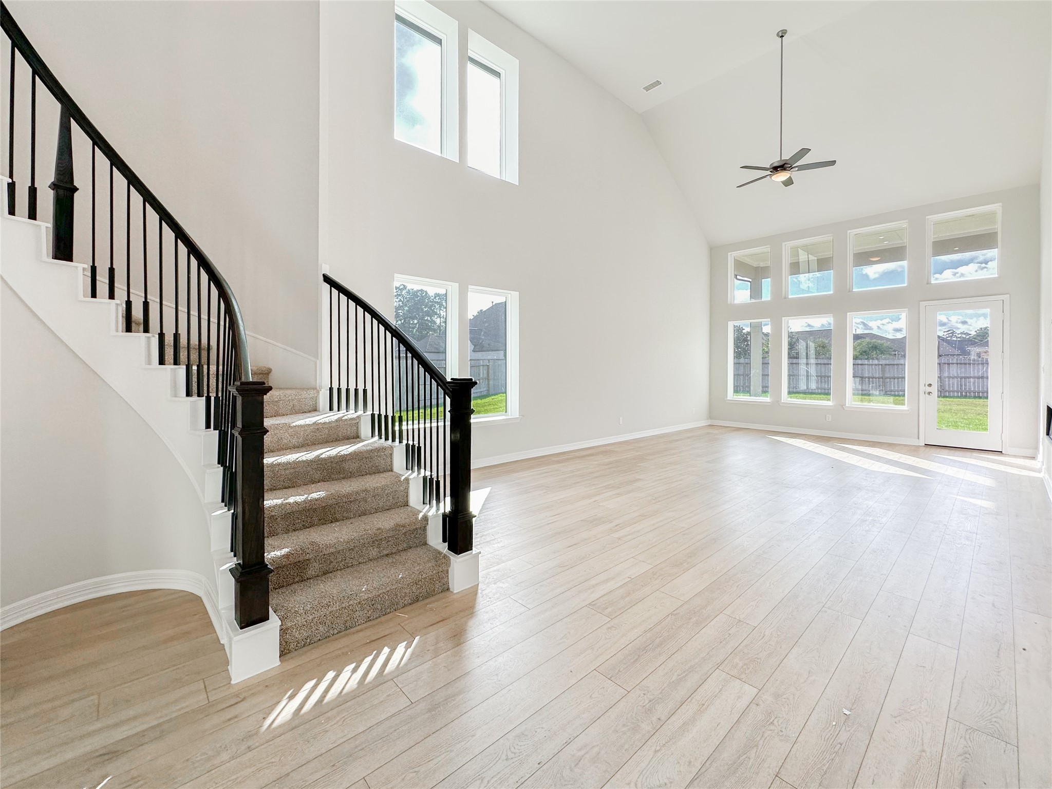 9411 Coleraine Court Tomball, TX 77375 - Photo 8 of 34 a view of an entryway with wooden floor and stairs