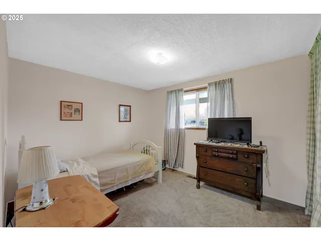 a living room with furniture and a lamp