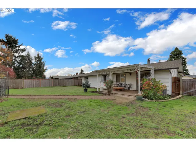 a view of a yard in front of a house with a yard