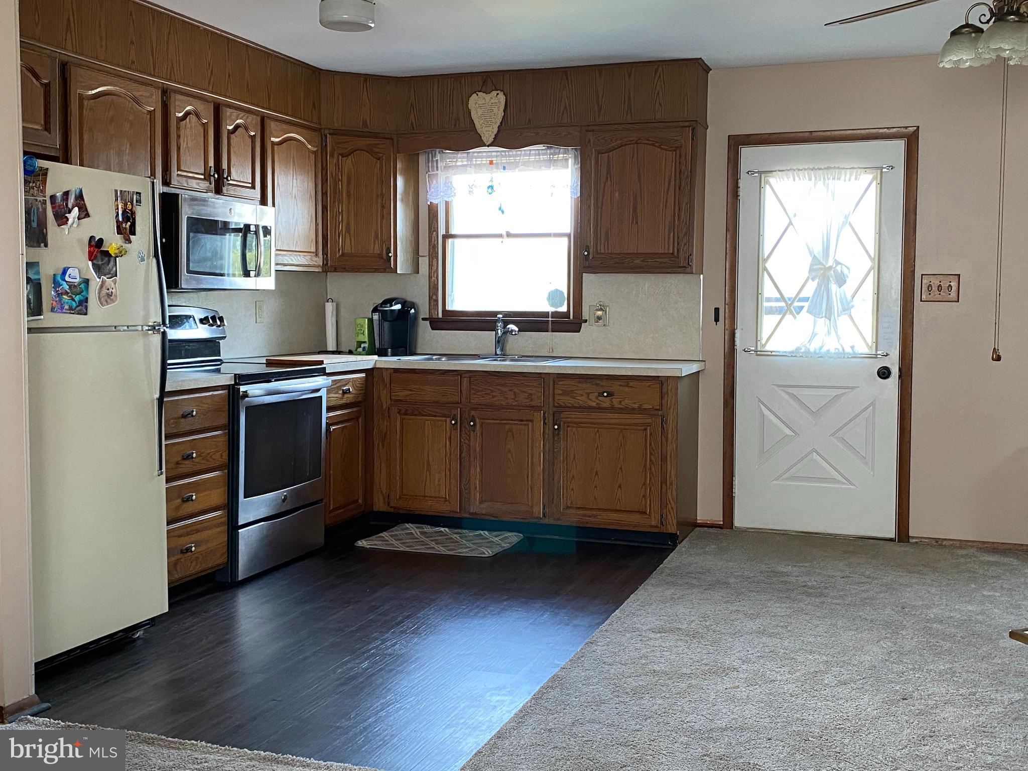 2798 Rachele Court Manchester, MD 21102 - Photo 41 of 42 Open Concept Kitchen with Door to Rear Deck
