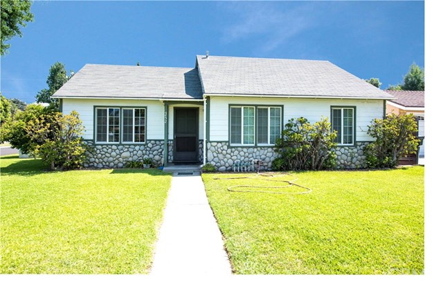 a view of house with swimming pool outdoor seating