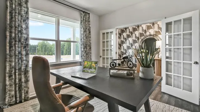 a view of a dining room with furniture and window