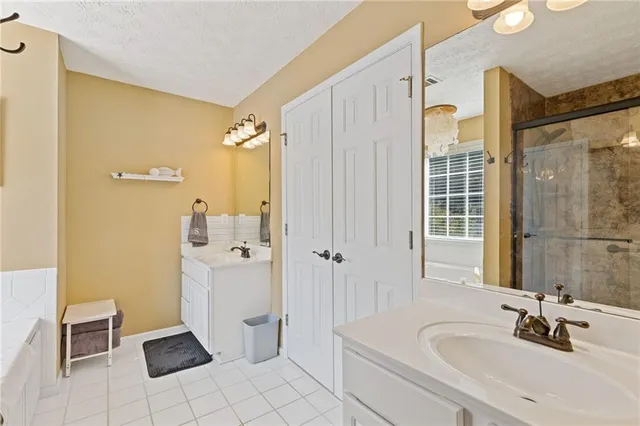 a bathroom with a shower and a sink