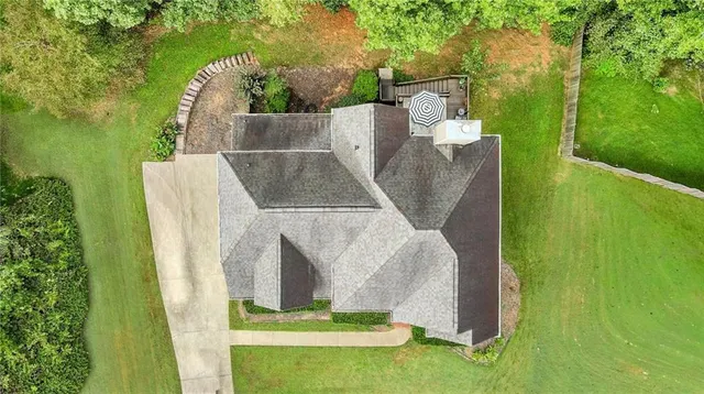 a view of a chairs and table in the balcony