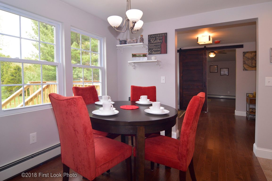 13 Maxson Hill Road Hopkinton, RI 02804 - Photo 13 of 33 Dining area adjacent to the kitchen, lovely light and bright space to enjoy meals and overlooking a pretty yard