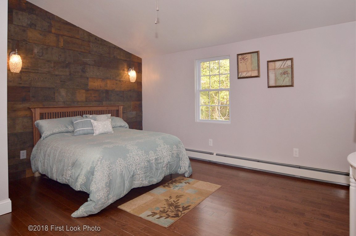 13 Maxson Hill Road Hopkinton, RI 02804 - Photo 16 of 33 Your choice of having a Masterbed/bath on the first floor OR a spacious family room with access to a full bathroom. tons of options with this first floor large space