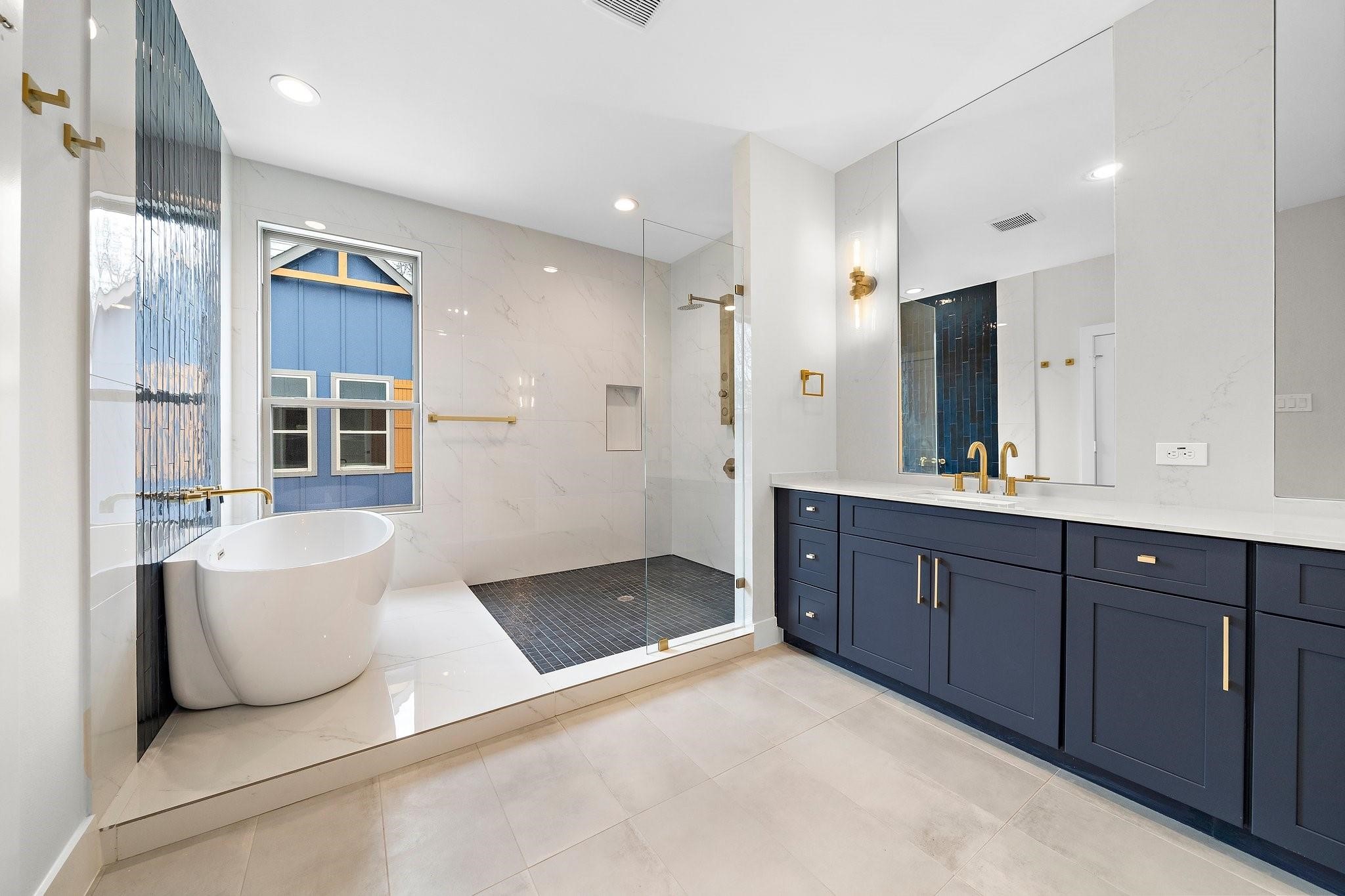 2200 Marnel Road, Unit J Houston, TX 77055 - Photo 15 of 25 a spacious bathroom with a tub sink and mirror