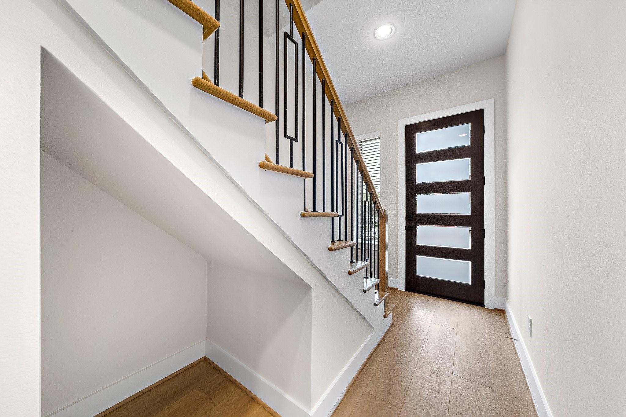 2200 Marnel Road, Unit J Houston, TX 77055 - Photo 4 of 25 a view of entryway and hall with wooden floor